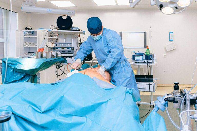 Dr. George Shamma demonstrating emergency tracheostomy procedure on medical training mannequin